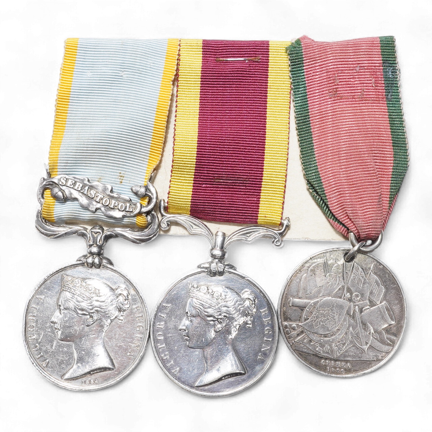 A mid 19th century medal trio awarded to No.1089. W. Lilckenday. 1st Dragoon Guards, comprising; a Victoria Crimea medal with a clasp for Sebastopol, a Victoria China medal and a Turkish Crimea 1855 medal